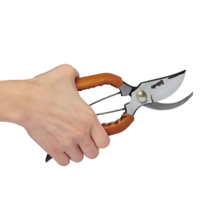 Hand holding the new Trendy Small Leather Handle in Camel Colour Open crafted by Toyama Hamono
