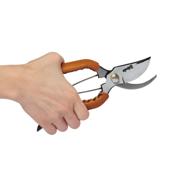 Hand holding the new Trendy Small Leather Handle in Camel Colour Open crafted by Toyama Hamono